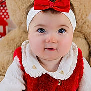 Lylia participe au concours pour gagner de l'argent avec cette photo : baby, child, chubby_cheeks, closeup, cute, face, happy, headband, holiday, indoor, infant, plush, portrait, red_bow, smiling, soft_texture, teddy_bear, vest, white_clothing, young_child