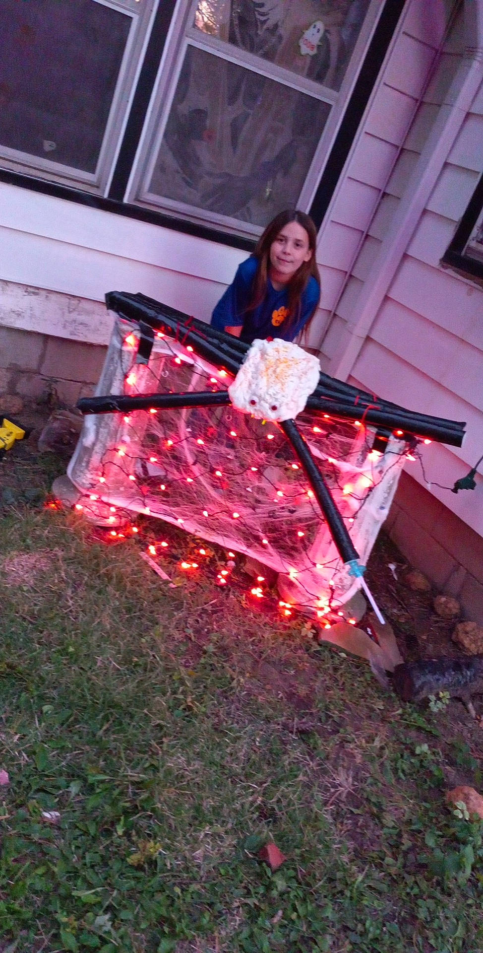 Jasmin is registered to the contest to win money with this photo: carmine, costume, entertainment, event, fire, flesh, fun, grass, heat, holiday, joy, leisure, magenta, performance_art, person, pink, recreation, sitting, t_shirt, tradition