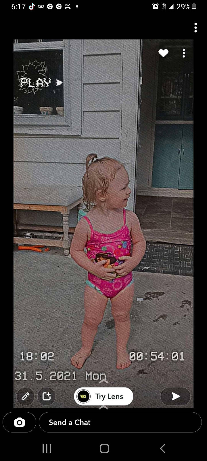 Kinsley is registered to the contest to win money with this photo: baby_toddler_clothing, child, door, electronic_device, flooring, foot, fun, happy, home_door, human_leg, leg, magenta, person, photo_caption, product, sitting, sportswear, t_shirt, thigh, toddler