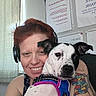 Chani Rae joined the competition — help win amazing prizes! woman, dog, pet, portrait, selfie, smiling, cuddling, indoor, headphones, tattoo, harness, black_and_white_dog, floppy_ears, animal, human, face, arms, window, curtain, wall
