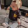 Kaeli Rose is registered to the contest to win money with this photo: baby, child, pacifier, headband, bow, tshirt, jeans, socks, blanket, indoor, floor, playpen, cute, sitting, infant, clothing, soft, cozy, childwear, person