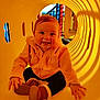 Kaeli Rose joined the competition — help win amazing prizes! baby, child, smiling, playground, yellow_tunnel, hoodie, boots, happy, cute, crawling, indoor, play, toddler, person, fun, bright, colorful, joy, cute_outfit, infant