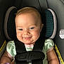 baby, car_seat, child, smile, happy, infant, blue_eyes, safety_harness, toy, cute, person, seatbelt, clothing, indoor, young_child, head_support, portrait, skin, cheeks, infant_toy