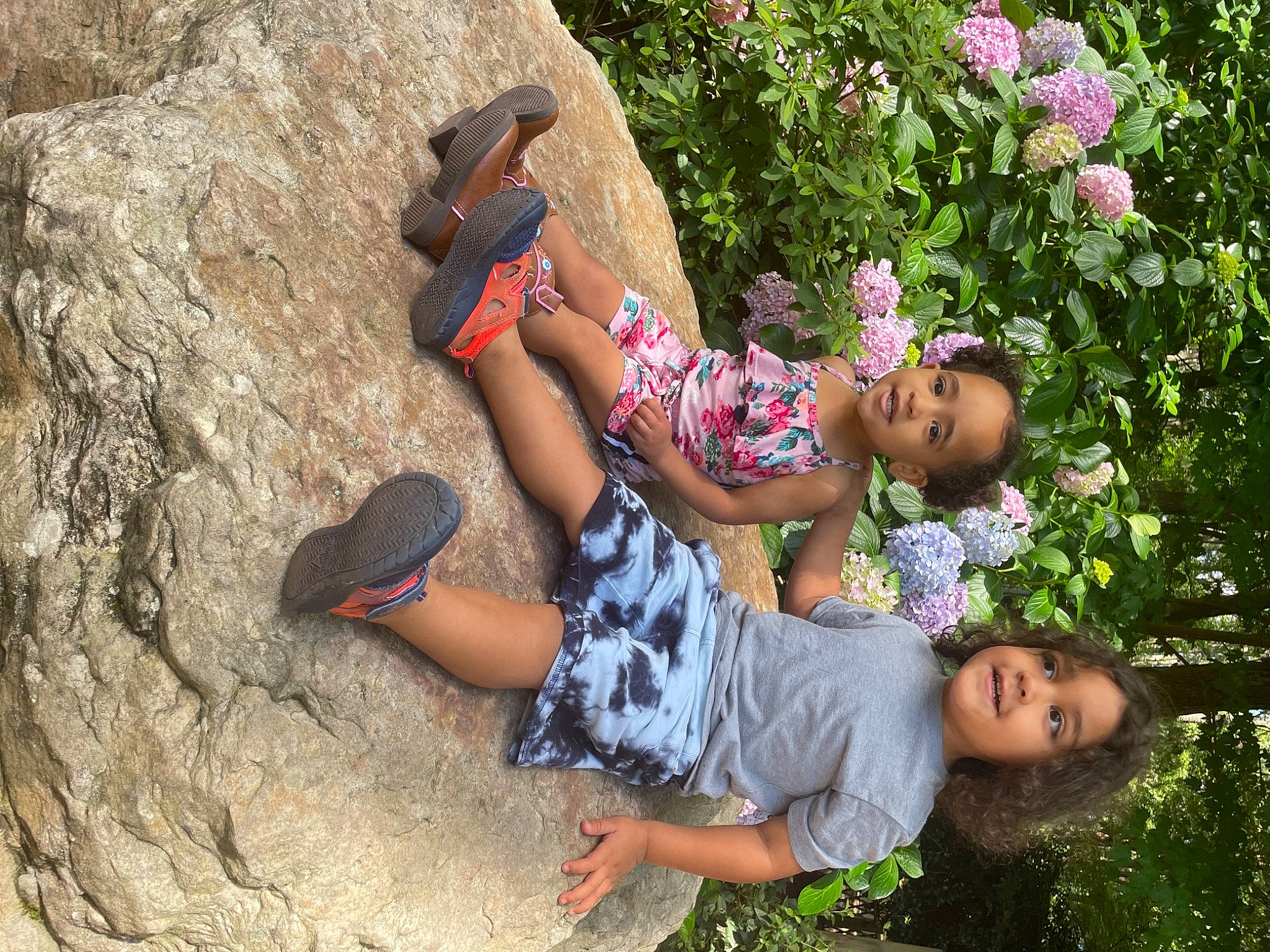 Hunter is registered to the contest to win money with this photo: bedrock, flip_flops, fun, grass, happy, hat, leisure, nature, people, people_in_nature, person, plant, recreation, sandal, shorts, summer, t_shirt, thigh, toddler, travel