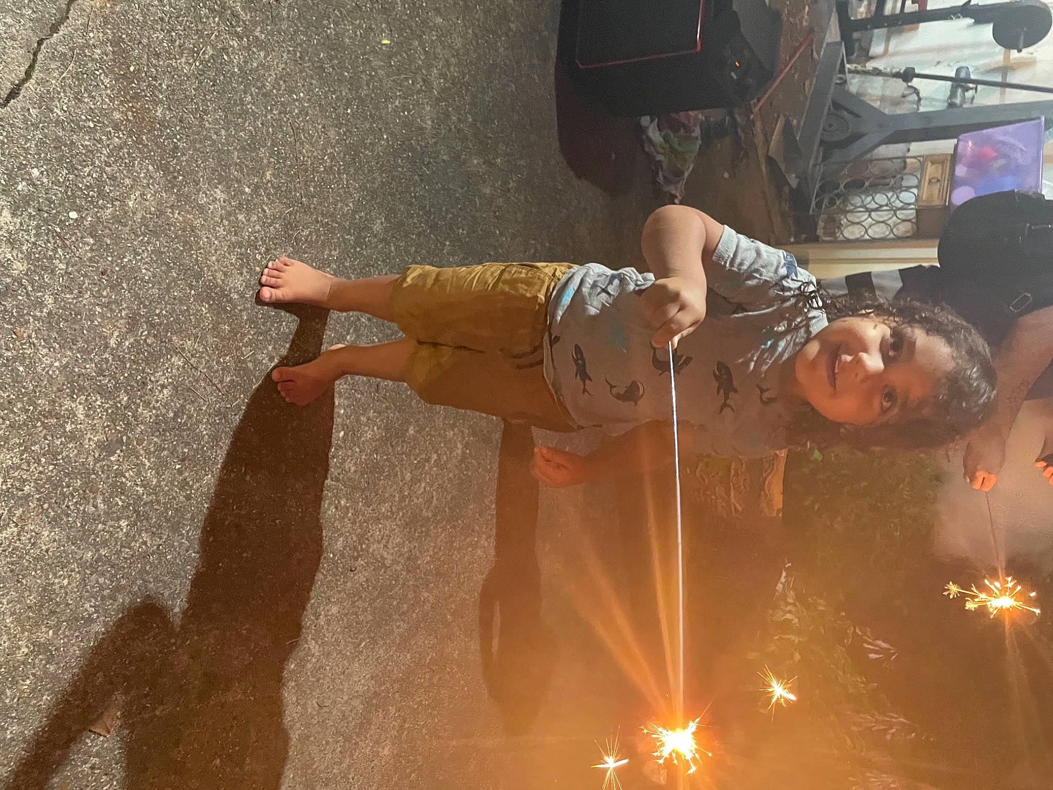 Hunter is registered to the contest to win money with this photo: asphalt, concrete, entertainment, event, fun, heat, human_leg, joy, lens_flare, metal, performance_art, person, public_event, road_surface, sandal, shadow, soil, thigh, waist