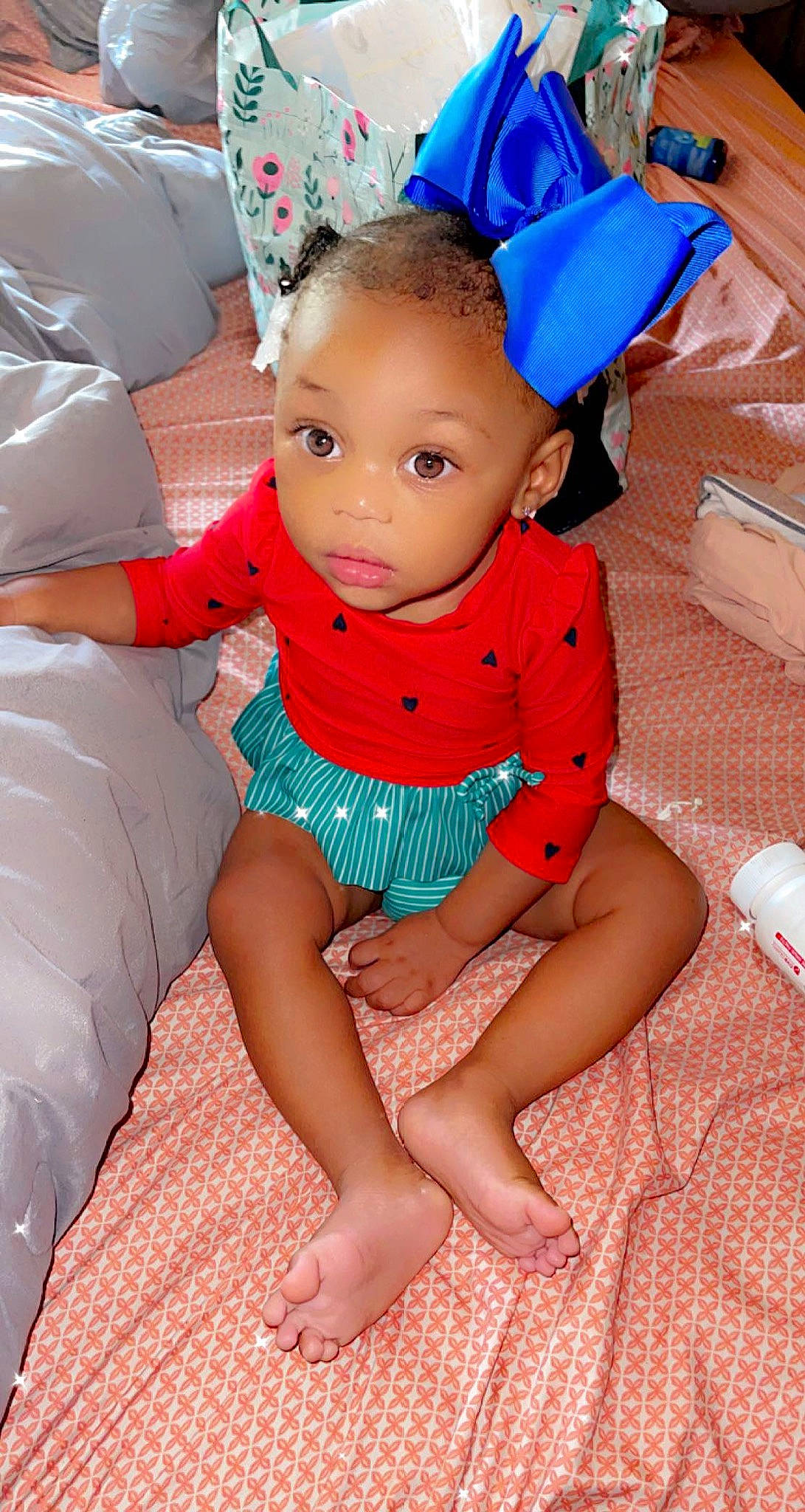 Macie is registered to the contest to win money with this photo: baby_toddler_clothing, blue, child, comfort, dress, eye, facial_expression, finger, hairstyle, happy, head, human_body, leg, mouth, neck, person, pink, skin, sleeve, thigh