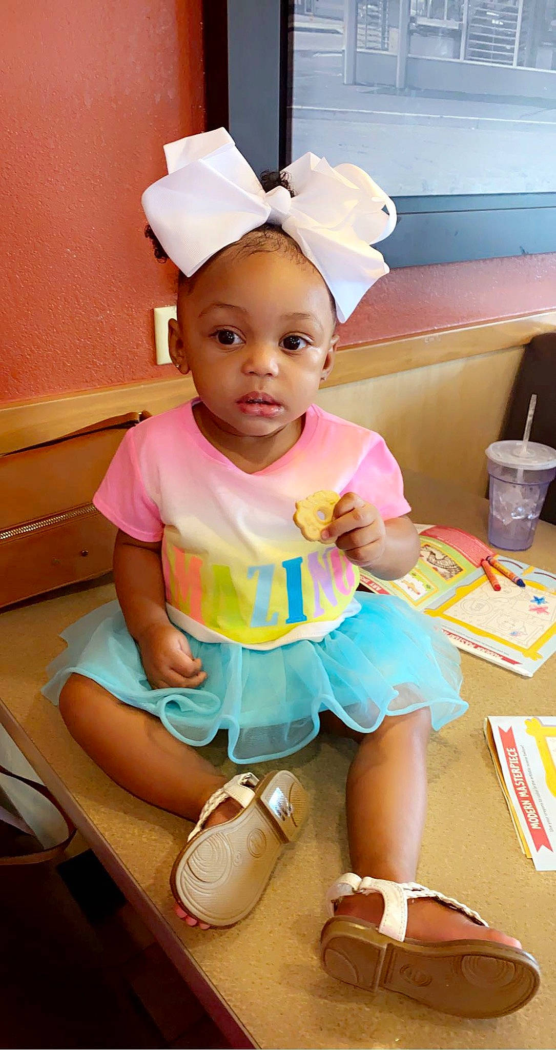 Macie is registered to the contest to win money with this photo: baby, baby_toddler_clothing, cap, child, fashion_accessory, fun, happy, human_leg, leisure, magenta, pattern, person, pink, play, room, sandal, shorts, sitting, sock, toddler