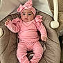 baby, baby_girl, baby_seat, bow, child, clothing, comfortable, cushion, cute, face, headband, indoors, infant, pearl, person, pink_clothing, portrait, relaxing, socks, soft_fabric