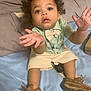 toddler, child, boy, curly_hair, shirt, bow_tie, shorts, brown_shoes, bed, pillow, blanket, indoor, person, expression, hands, open_mouth, sitting, looking_up, cute, clothing