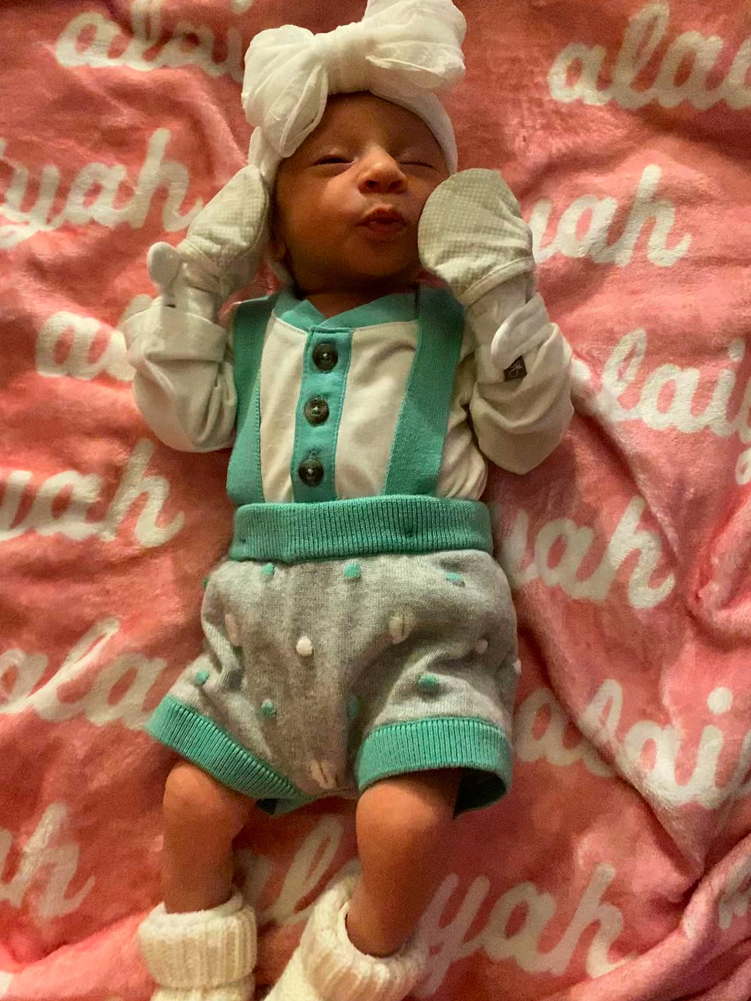 Alaiyah joined the competition — help win amazing prizes! baby, baby_toddler_clothing, barefoot, child, comfort, foot, green, happy, headwear, human_leg, linens, pattern, peach, person, pink, sitting, sleeve, smile, textile, thigh