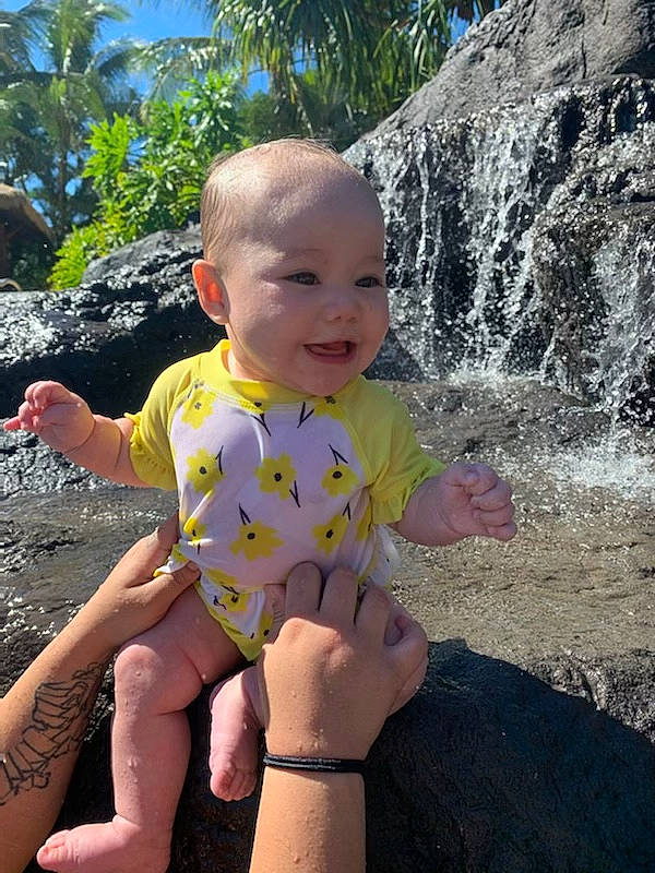 Mila-rose is registered to the contest to win money with this photo: arecales, arm, baby, baby_toddler_clothing, bracelet, finger, foot, hand, nail, palm_tree, person, skin, summer, thumb, toddler, toe, tropics, vacation, water_feature, waterfall