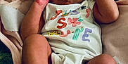 Ivori joined the competition — help win amazing prizes! baby, infant, blanket, onesie, foot, hand, face, skin, newborn, cute, sleepy, soft, cozy, clothing, lying_down, closeup, child, person, indoors, resting