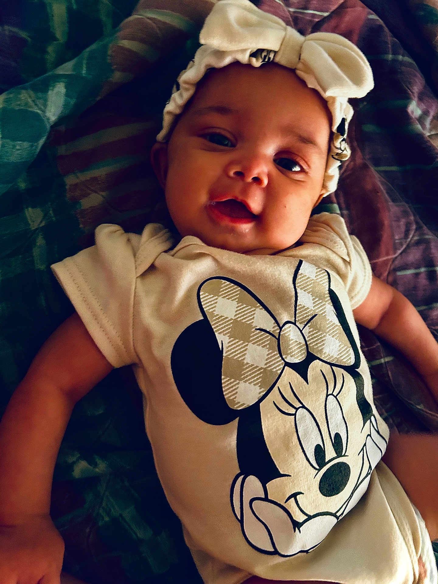 Ivori joined the competition — help win amazing prizes! baby, infant, headband, bow, onesie, minnie_mouse, smile, lying_down, blanket, clothing, cute, child, portrait, face, happy, closeup, indoor, baby_girl, apparel, infant_clothing