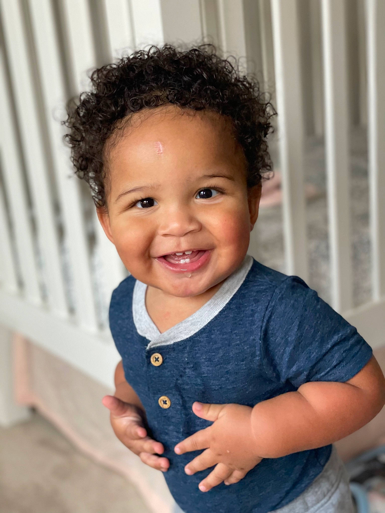 Gregory is registered to the contest to win money with this photo: baby, baby_toddler_clothing, beauty, cheek, child, electric_blue, eye, eyelash, gesture, hairstyle, happy, iris, joy, lip, nose, pattern, person, skin, sleeve, smile