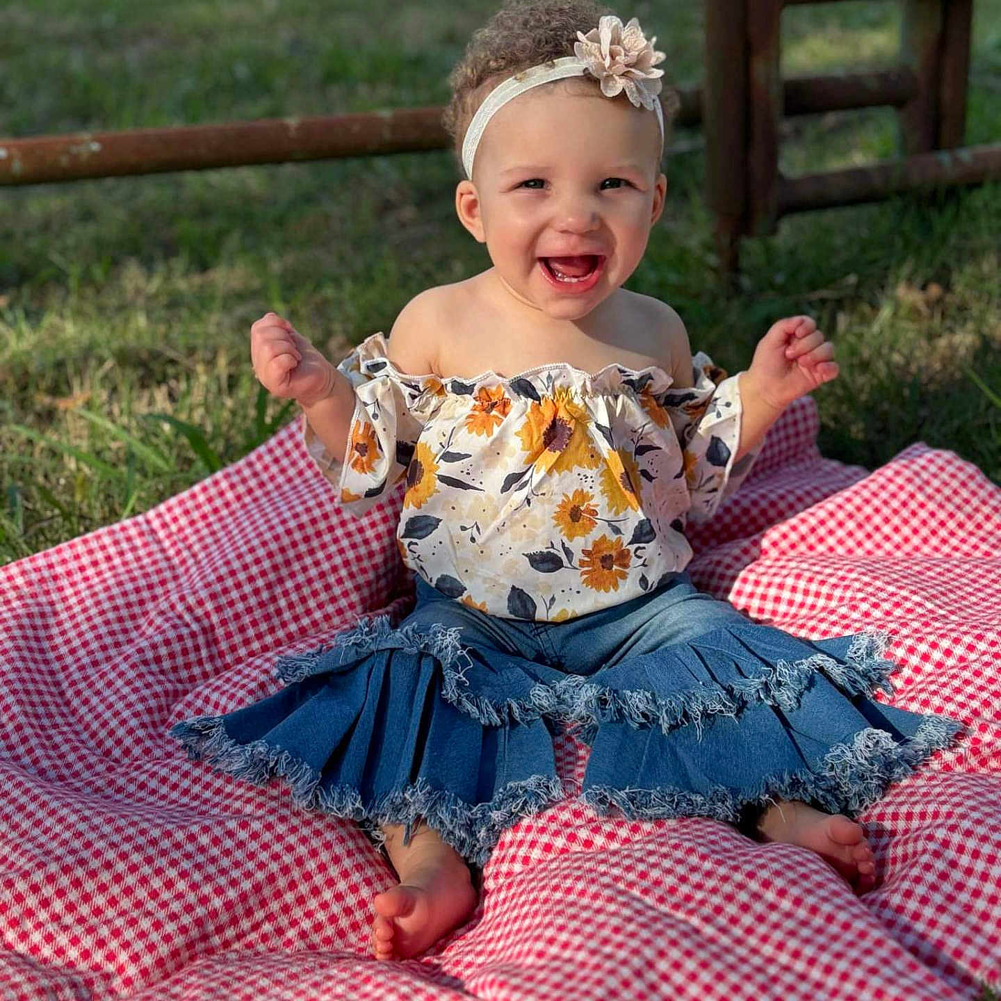 Tylah is registered to the contest to win money with this photo: baby, backyard, clothing, dress, face, grass, happy, head, jeans, nature, outdoors, pants, park, person, photography, plant, portrait, quilt, sitting, yard