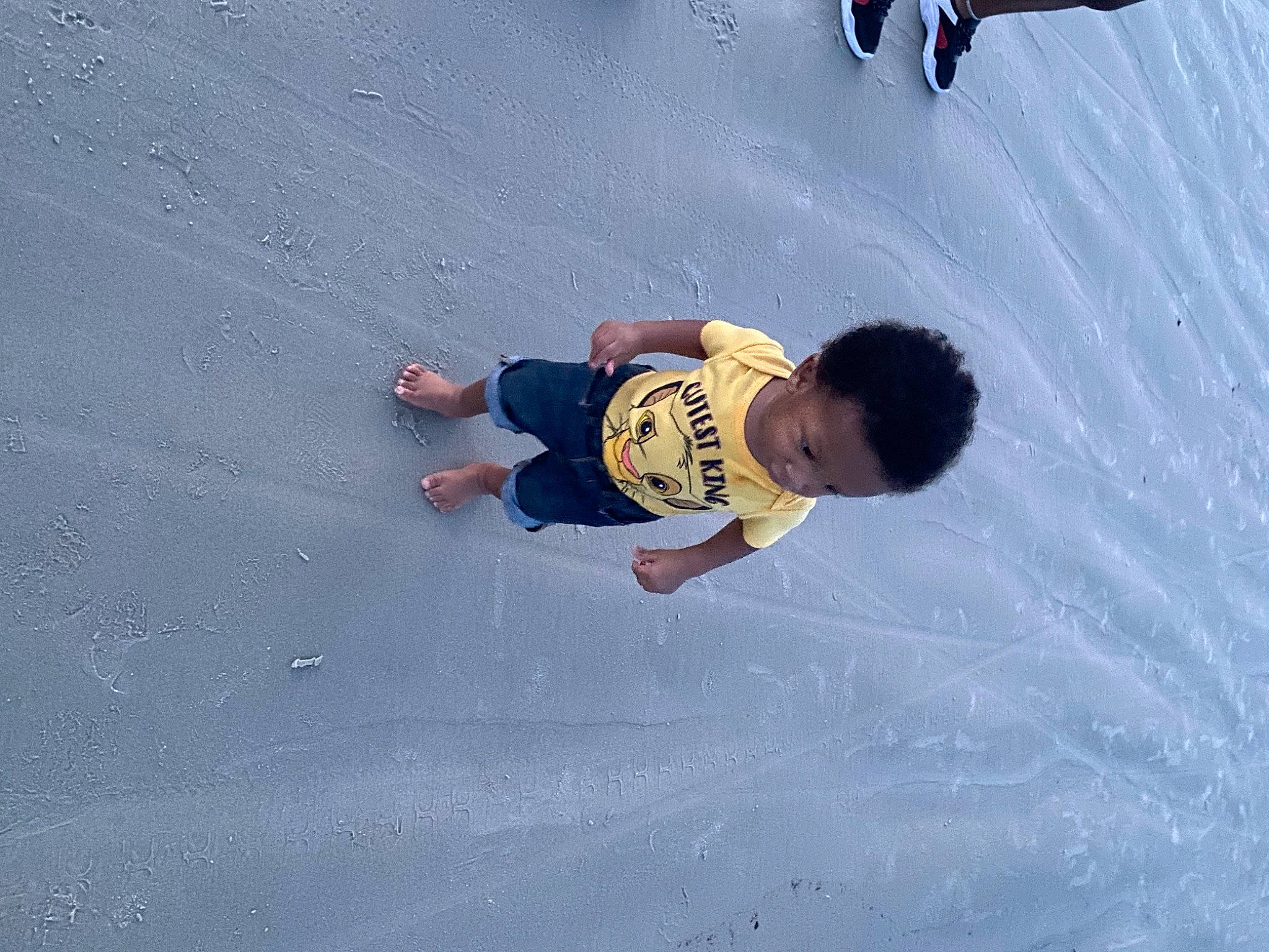 Khylen joined the competition — help win amazing prizes! asphalt, barefoot, beach, child, concrete, foot, fun, happy, leisure, ocean, people_in_nature, person, play, recreation, sand, shadow, t_shirt, toddler, water, wave