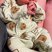 Kingston is registered to the contest to win money with this photo: arm, baby, closeup, clothing, cookie_pattern, cute, face, hands, indoor, infant, milk_pattern, newborn, onesie, peaceful, person, portrait, resting, skin, sleeping, soft_lighting