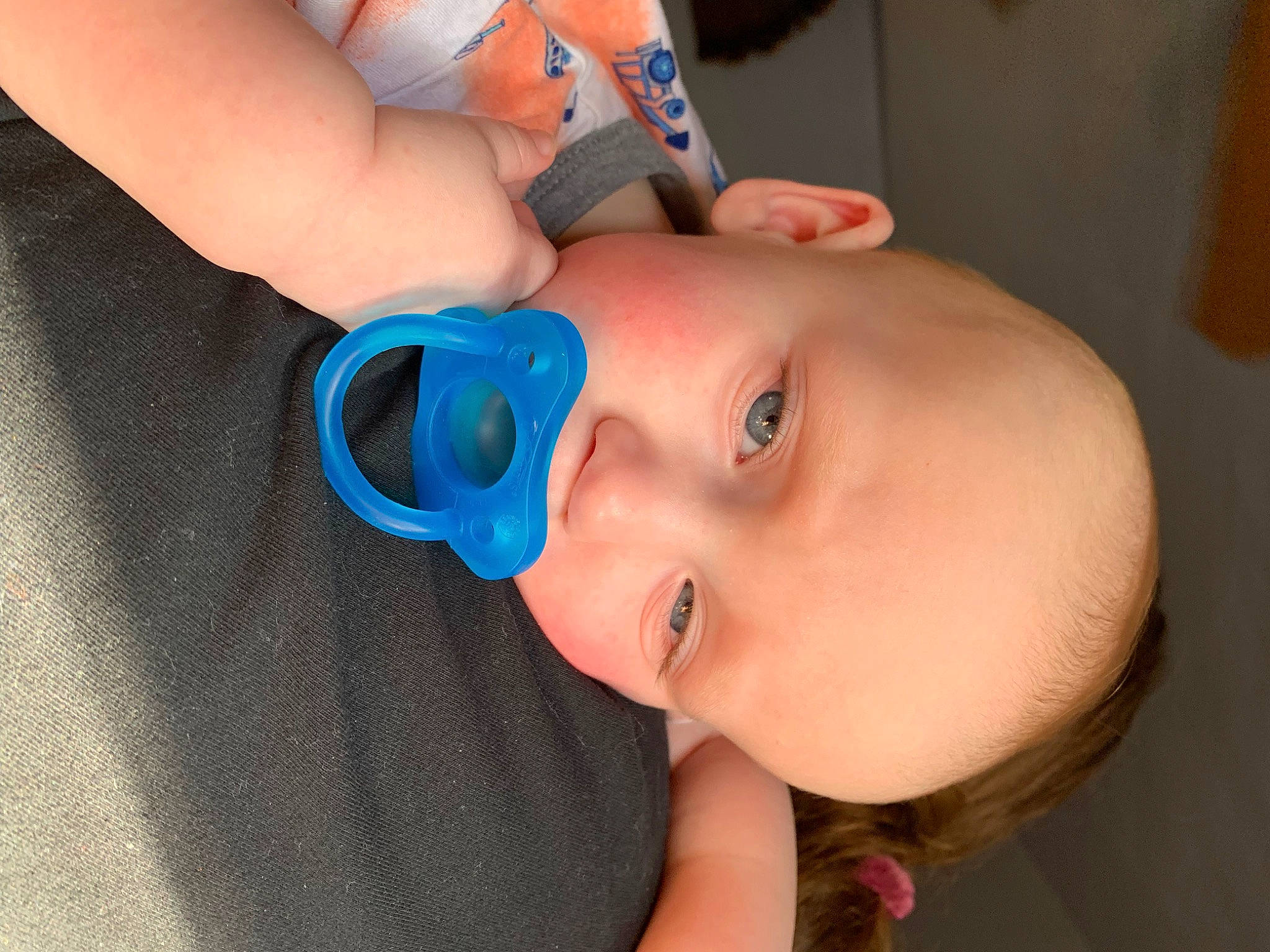 Eli is registered to the contest to win money with this photo: baby, baby_toddler_clothing, cheek, drinkware, ear, eye, eyebrow, eyelash, finger, hairstyle, hand, happy, headgear, iris, lip, mouth, neck, nose, person, skin