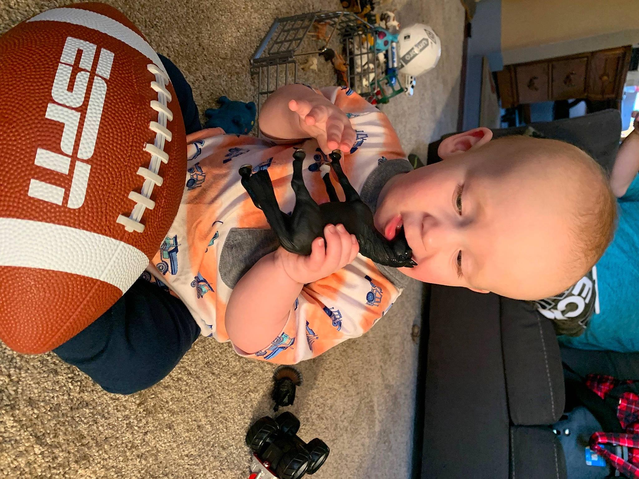 Eli is registered to the contest to win money with this photo: child, cool, costume, drum, fashion_accessory, fun, glove, idiophone, musical_instrument, orange, person, personal_protective_equipment, sports_gear, t_shirt, toddler