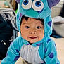 toddler, child, costume, onesie, monster, blue, purple, crawling, carpet, indoors, smiling, cute, baby, face, eyes, hood, playful, soft, home, young