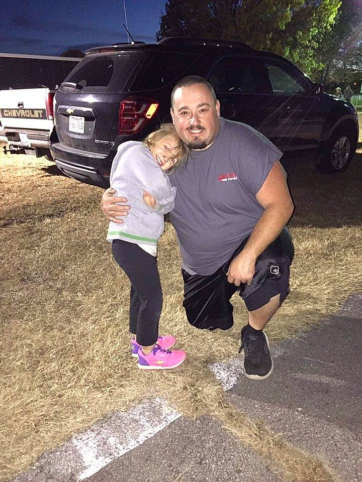 Ryleigh is registered to the contest to win money with this photo: asphalt, automotive_design, automotive_exterior, automotive_lighting, automotive_tire, bumper, car, cool, grass, joy, land_vehicle, leg, mammal, motor_vehicle, person, road_surface, sneakers, tire, tree, vehicle