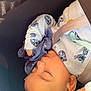 baby, blanket, car_seat, child, closeup, comfort, cute, face, hand, head, indoors, infant, nap, pajamas, peaceful, resting, safety_belt, sleeping, soft_toy, young_child
