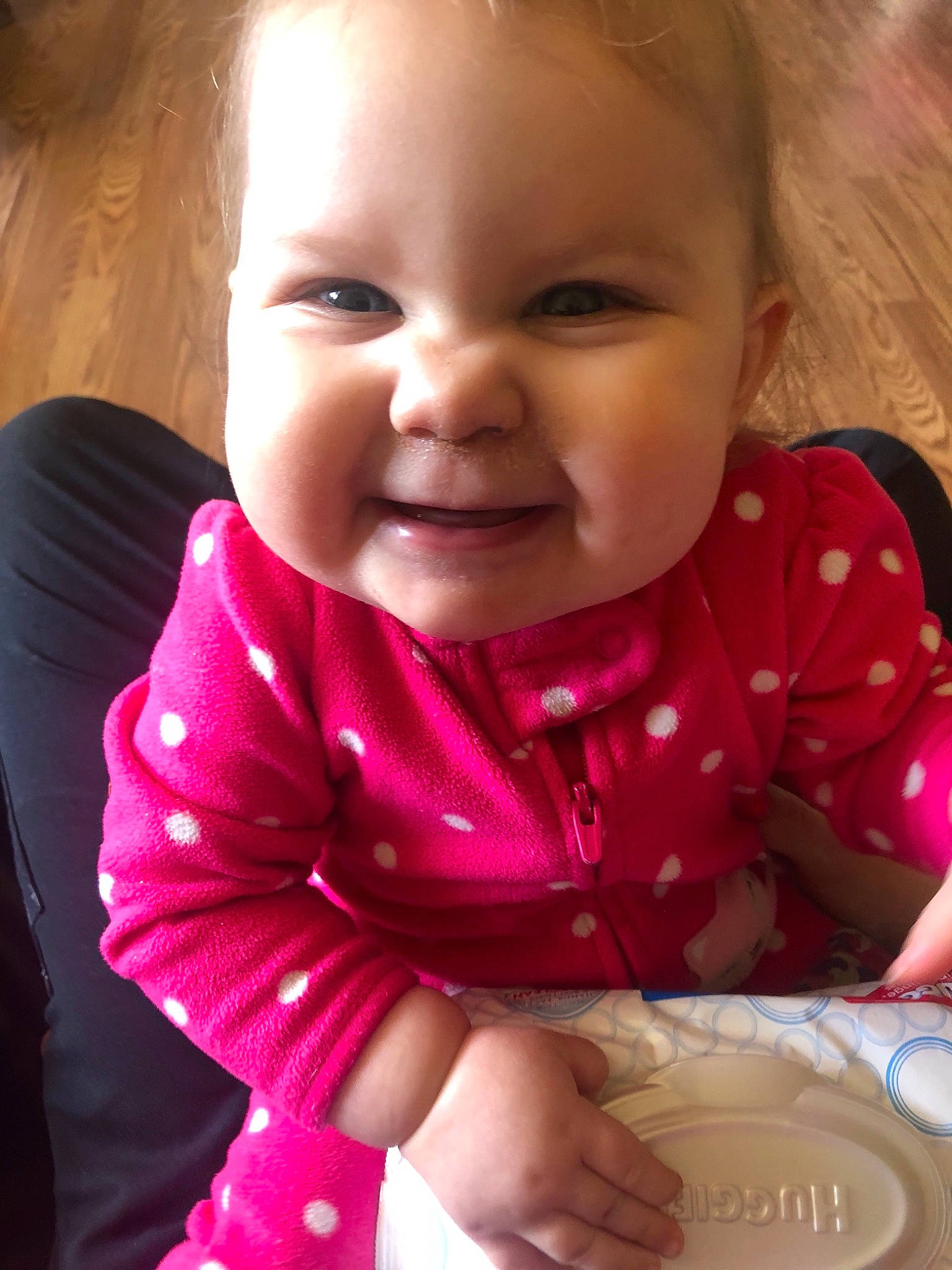 Katelynn is registered to the contest to win money with this photo: baby, cheek, child, face, head, joy, lip, mouth, nose, person, pink, sitting, skin, smile, toddler