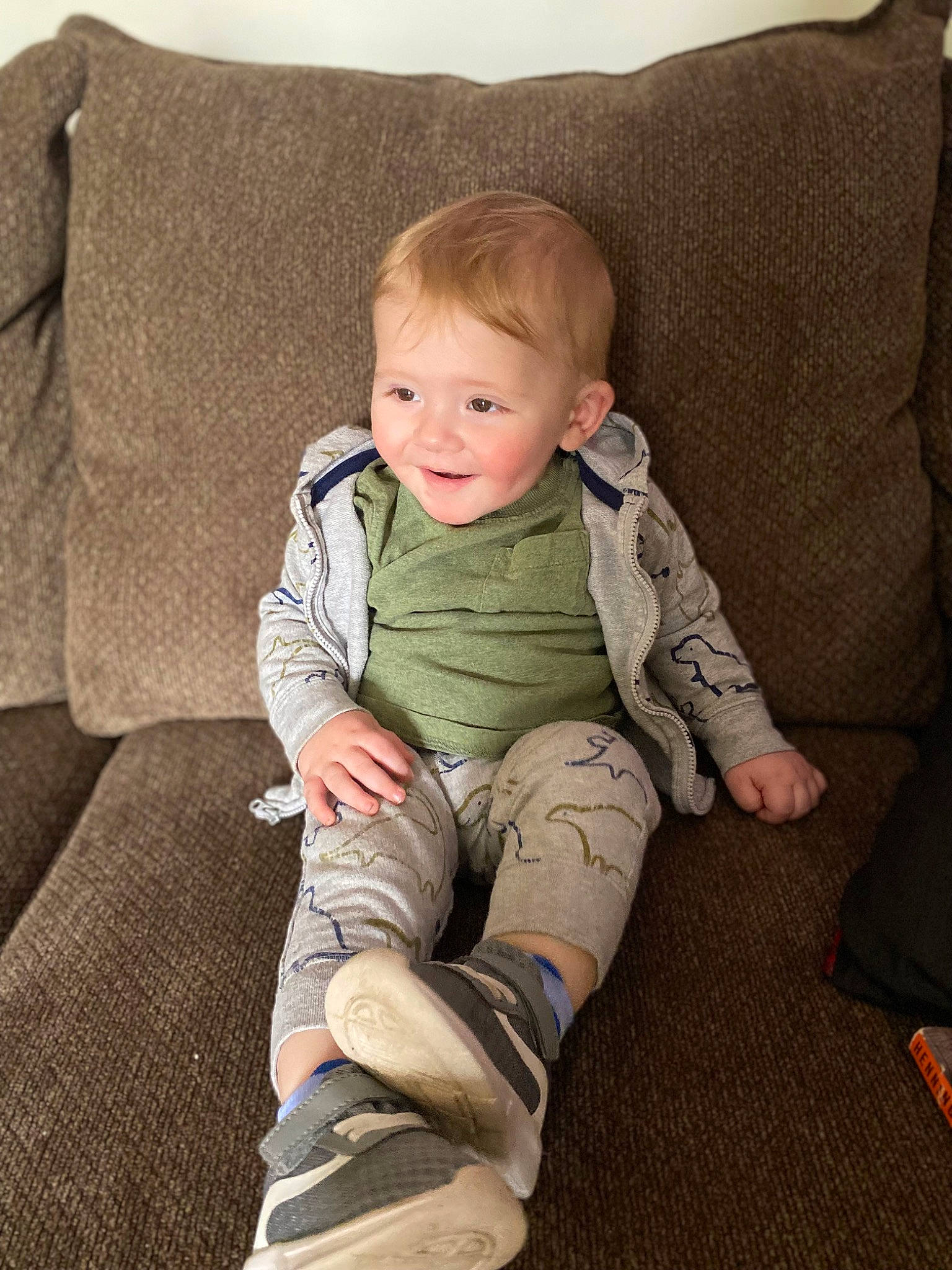 Jaxson is registered to the contest to win money with this photo: baby, baby_toddler_clothing, cheek, child, comfort, couch, eye, flooring, foot, human_leg, joy, knee, lap, linens, person, sitting, skin, sleeve, smile, thigh
