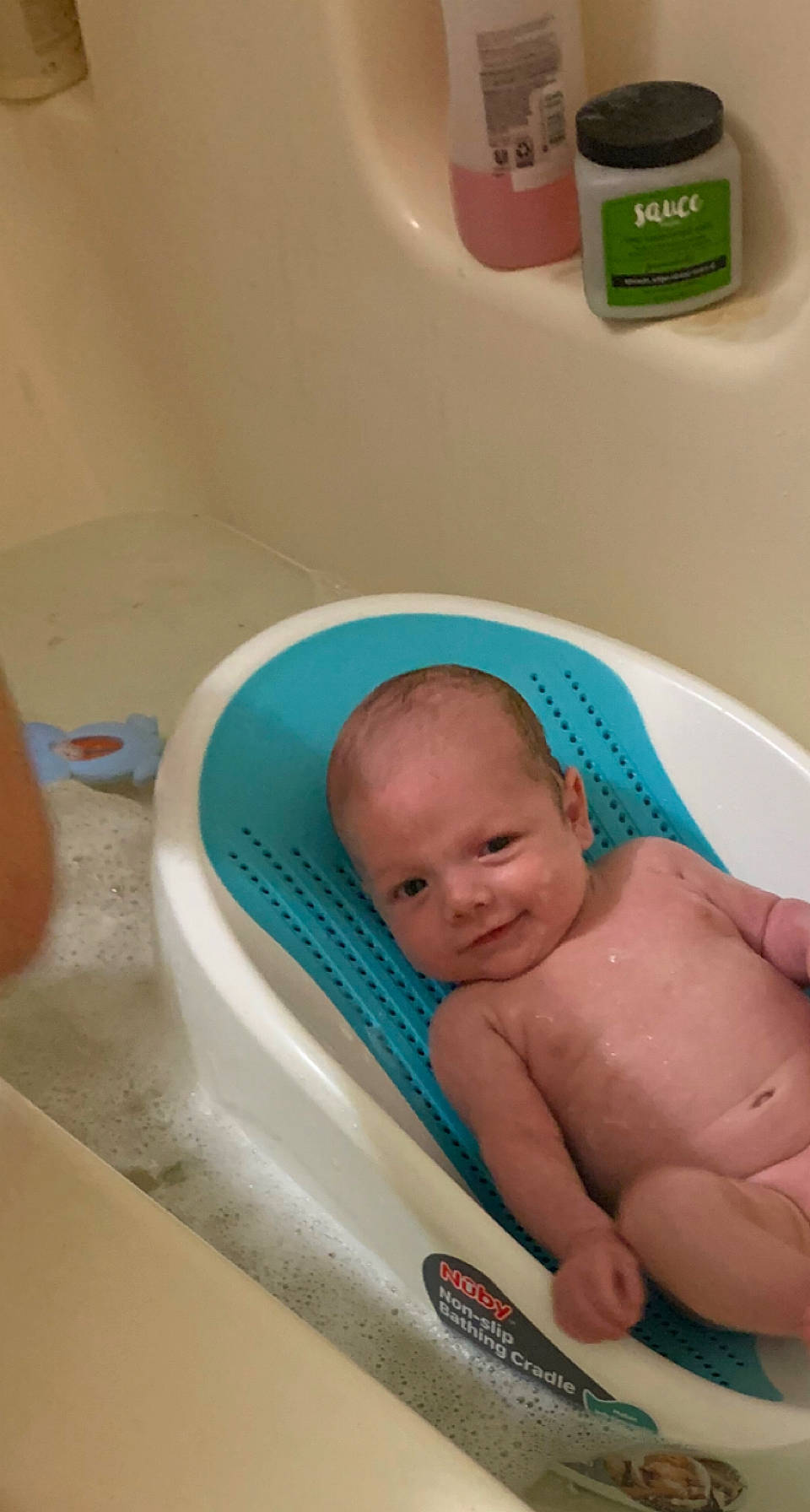 Braxton is registered to the contest to win money with this photo: baby, baby_bathing, baby_products, baby_safety, bathing, bathroom, bathtub, chest, child, comfort, fluid, household_supply, person, personal_care, plumbing, plumbing_fixture, product, room, stomach, thumb