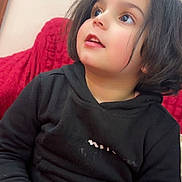 Lawrence joined the competition — help win amazing prizes! black_hoodie, casual_clothing, child, comfortable, cozy, curious, cute, expression, face, home, indoor, long_hair, looking_up, person, portrait, red_background, seated, sitting, studio_light, young_child