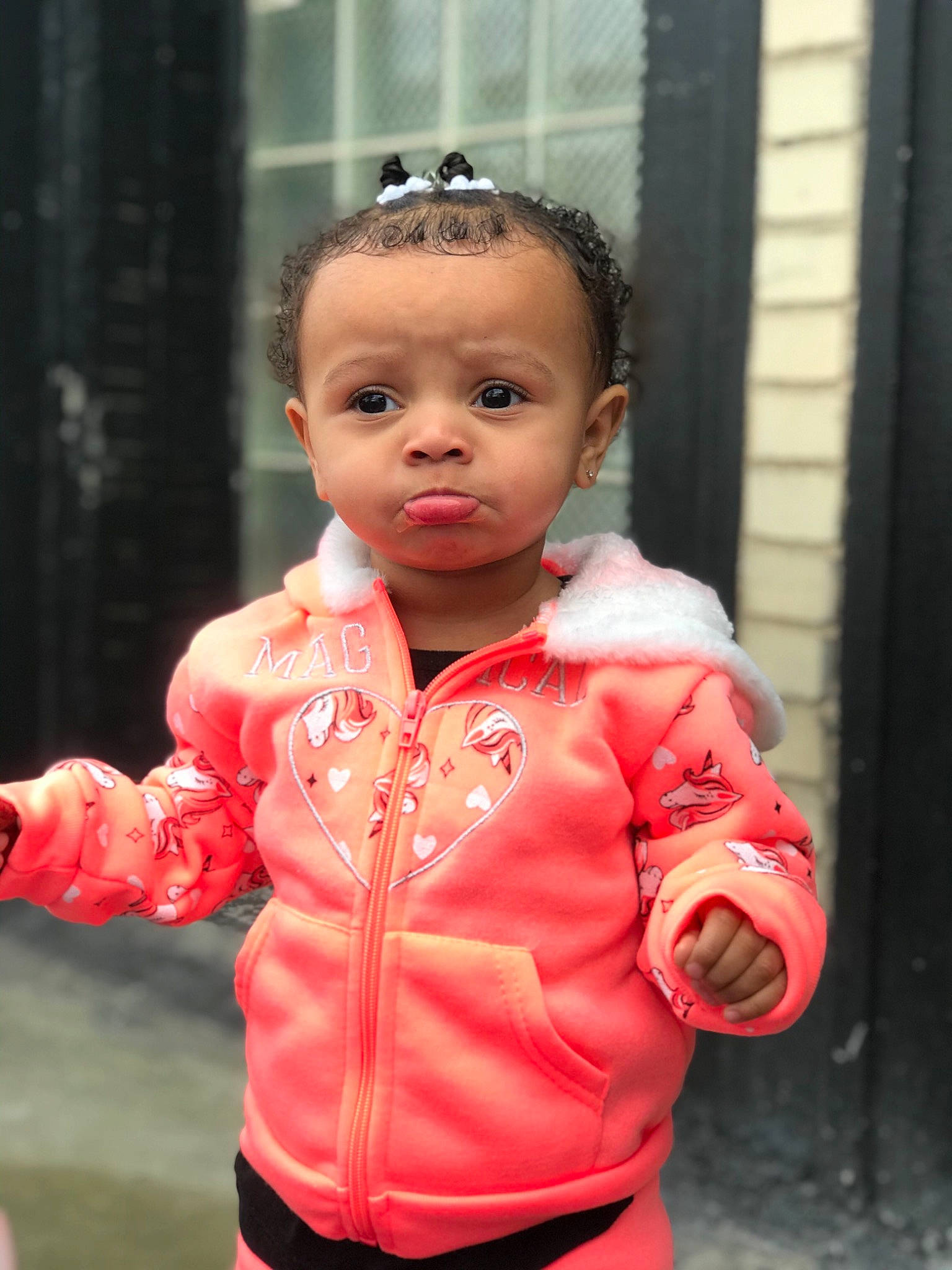 Amelie is registered to the contest to win money with this photo: baby, baby_toddler_clothing, cheek, child, chin, collar, event, eye, facial_expression, fun, happy, lip, nose, outerwear, person, personal_protective_equipment, pink, skin, sleeve, toddler