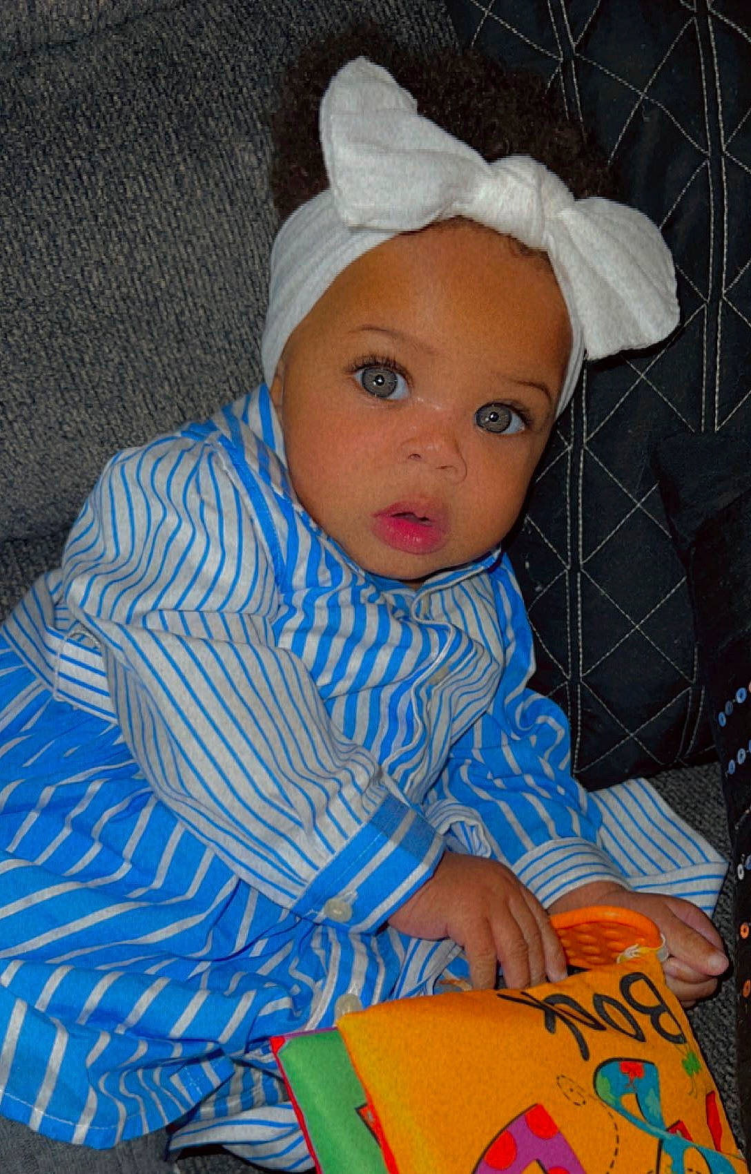 Brooklyn joined the competition — help win amazing prizes! baby, baby_toddler_clothing, beanie, bonnet, cap, child, electric_blue, fashion_accessory, hair_accessory, hat, headband, headpiece, knit_cap, linens, pattern, person, plastic, portrait_photography, room, sitting