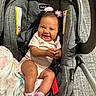 Iridessa joined the competition — help win amazing prizes! baby, infant, car_seat, blanket, smiling, pink_headband, socks, striped_onesie, indoor, happy, person, child, cute, seatbelt, floor, carrying_handle, fabric, pattern, closeup, portrait