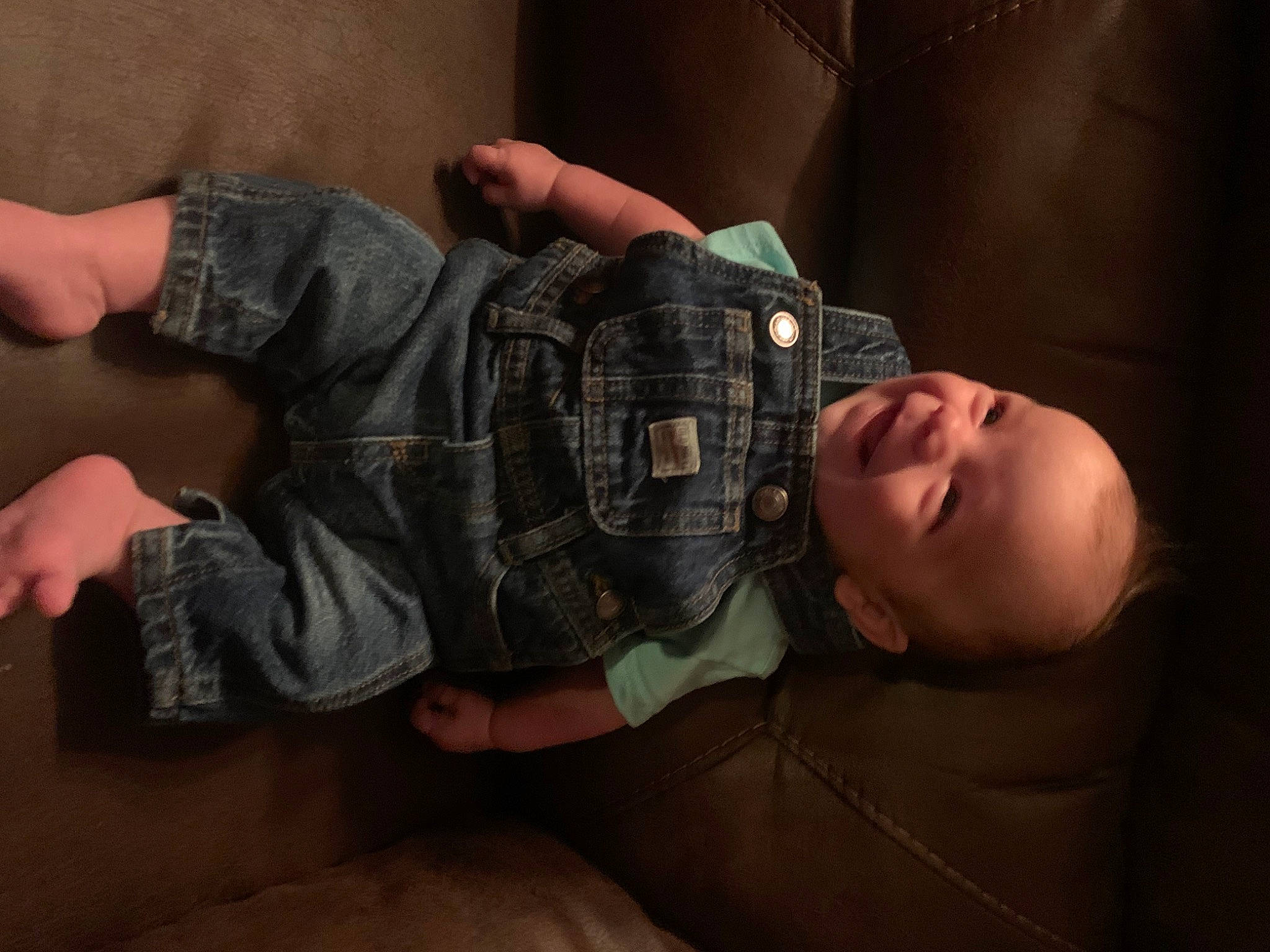 Hudson is registered to the contest to win money with this photo: abdomen, baby, baby_toddler_clothing, cheek, child, comfort, elbow, finger, flash_photography, fun, gesture, human_body, military_camouflage, mouth, person, skin, sleeve, thumb, toddler, wood
