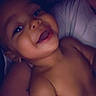baby, infant, child, smiling, happy, portrait, close_up, indoor, nighttime, cuddling, adult, face, eyes, mouth, bare_shoulders, blanket, bed, soft_lighting, cozy, family