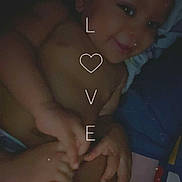 Jaiceon joined the competition — help win amazing prizes! baby, infant, child, portrait, smiling, cuddling, close_up, face, eyes, hands, adult_hand, indoor, dim_lighting, blanket, clothing, lying_down, cozy, love, text_overlay, family