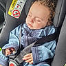 toddler, child, sleeping, car_seat, seat_belt, curly_hair, blue_clothing, embroidery, hands, face, safety, airbag_warning, interior_car, closeup, peaceful, young_child, resting, infant, portrait, seat_belt_buckle