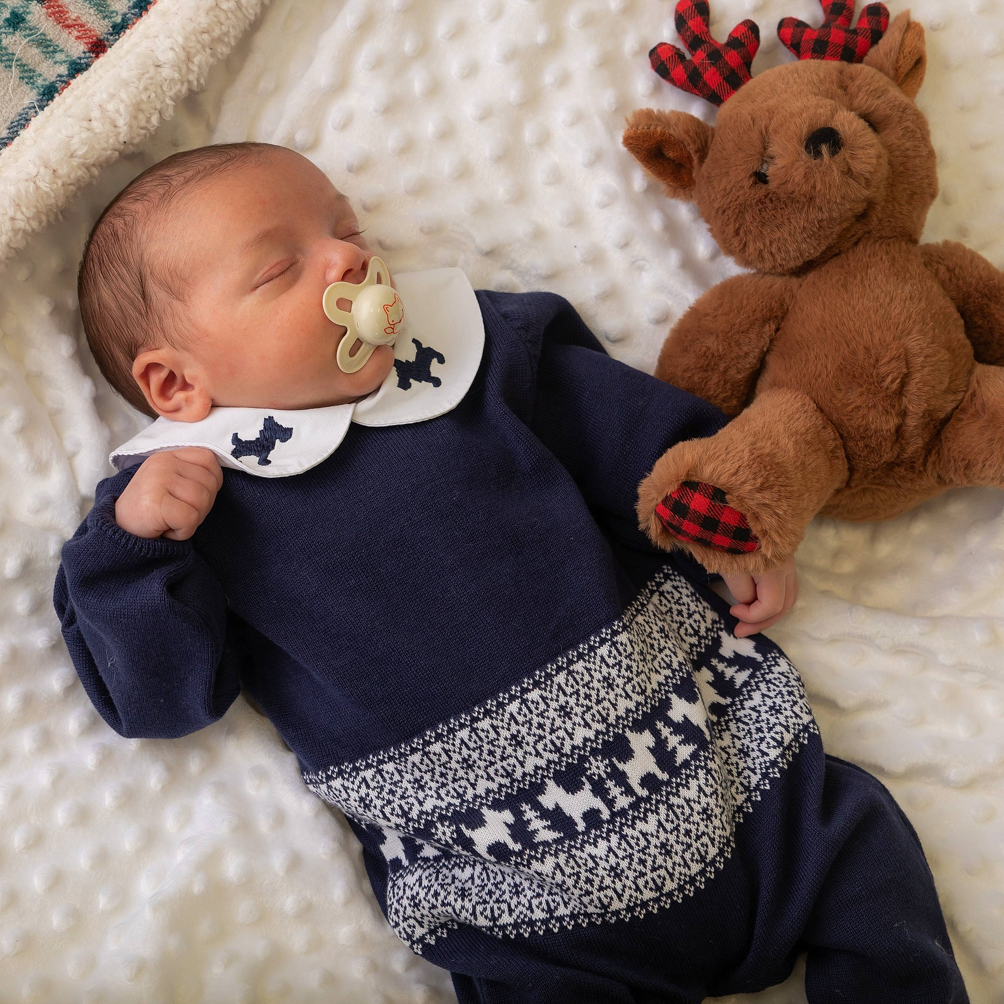 Elliot is registered to the contest to win money with this photo: arm, baby, baby_products, baby_sleeping, baby_toddler_clothing, cheek, child, comfort, headgear, human_body, organ, outerwear, pattern, person, skin, sleeve, textile, toddler, toy, white
