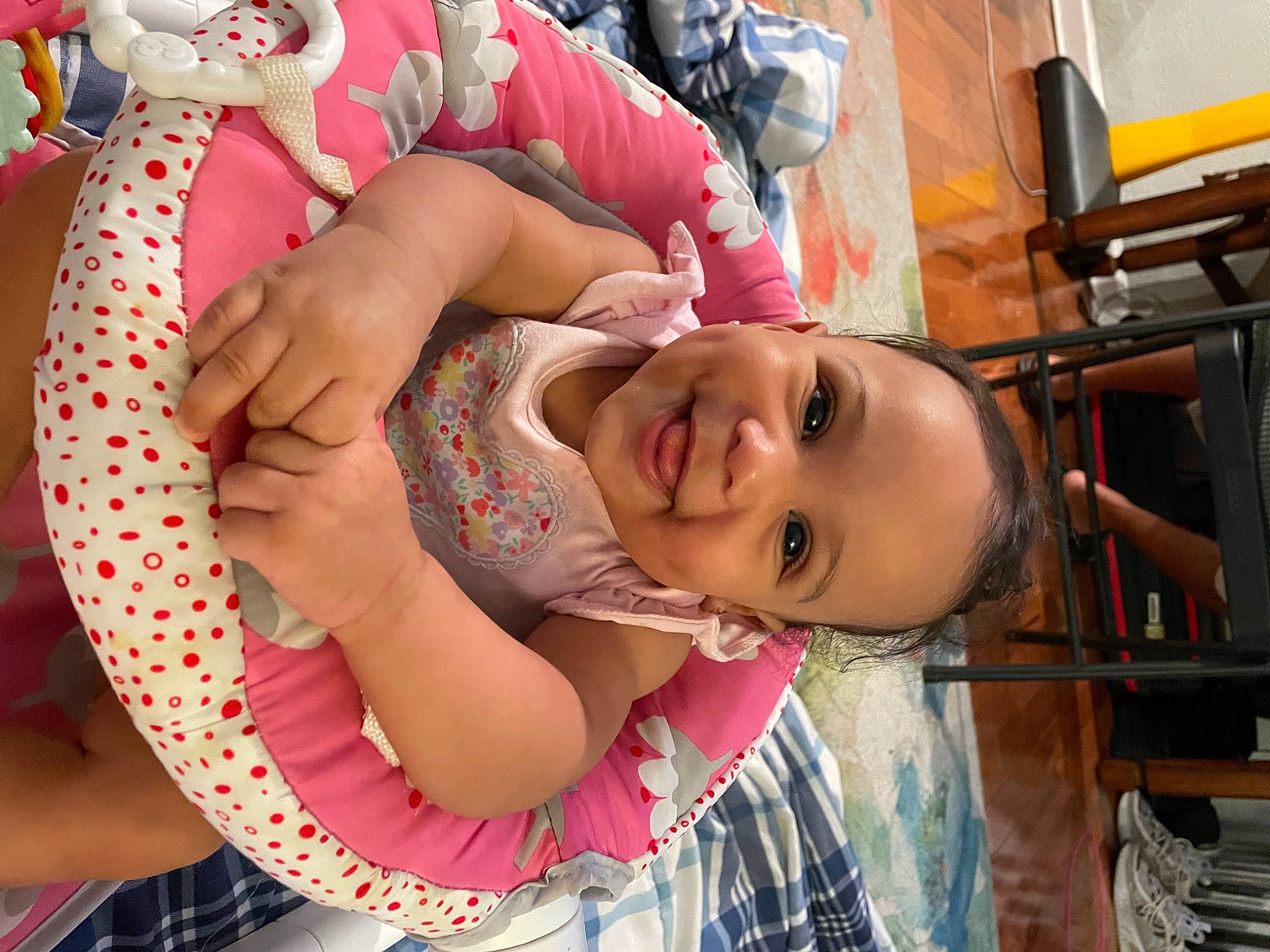 Soraya is registered to the contest to win money with this photo: baby, cheek, child, eyelash, fun, happy, joy, leisure, lip, magenta, mouth, neck, nose, pattern, person, pink, play, room, sitting, skin