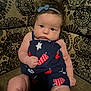 Adalynn Rose is registered to the contest to win money with this photo: baby, infant, child, blue_bow, navy_dress, popsicle_pattern, couch, patterned_fabric, curly_hair, chubby_cheeks, sitting, indoors, portrait, cute, serious_expression, headband, furniture, young_child, closeup, person
