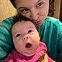 Adalynn Rose is registered to the contest to win money with this photo: baby, woman, face, expression, indoor, person, clothing, sweater, pink, blue, hair, skin, portrait, cute, holding, smiling, funny_face, closeup, human, casual