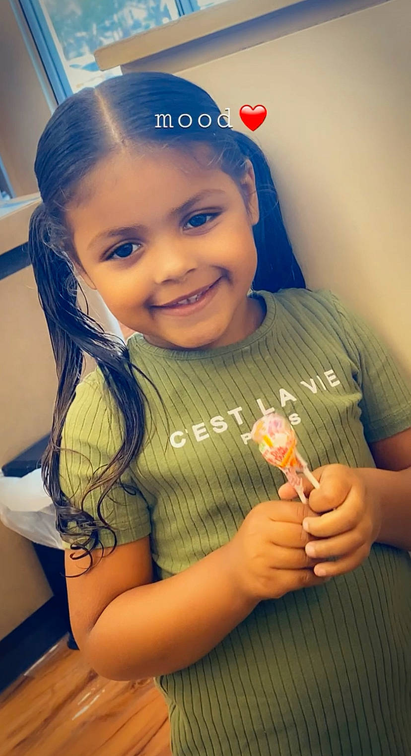 Kenzlie joined the competition — help win amazing prizes! arm, cheek, chin, drinkware, face, facial_expression, finger, gesture, hand, happy, head, human_body, joy, lip, mouth, nose, person, skin, smile, standing