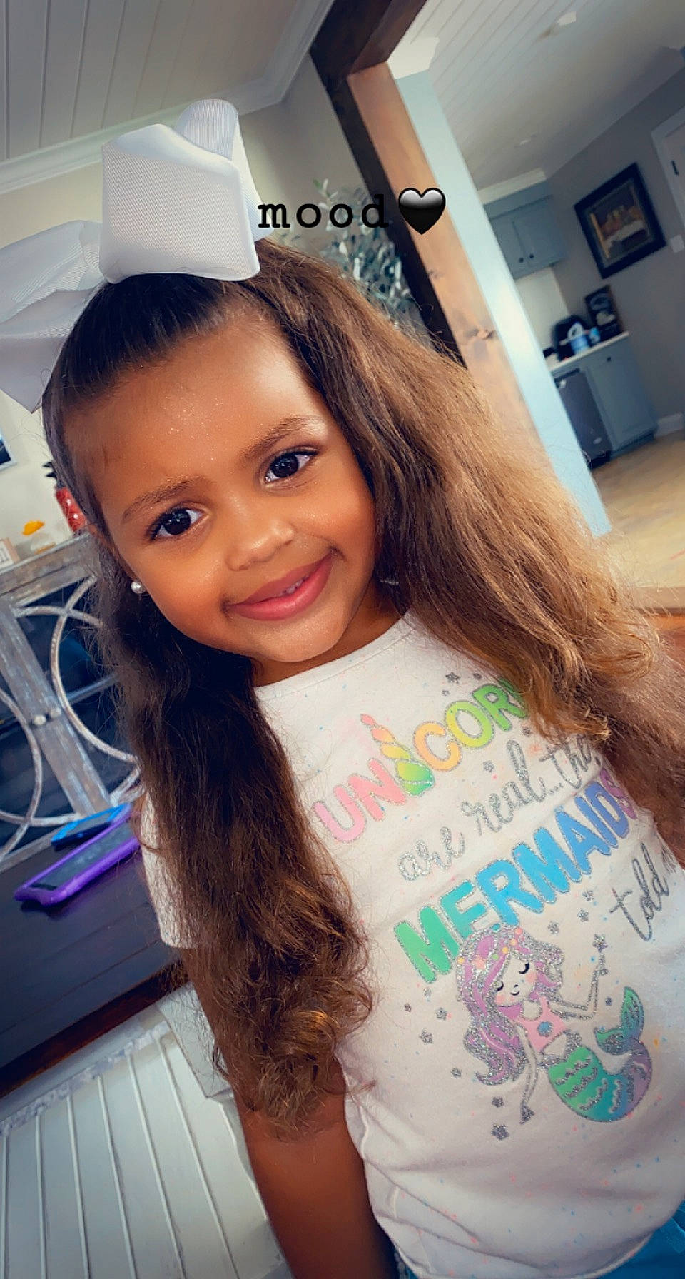 Kenzlie is registered to the contest to win money with this photo: blond, brown_hair, chair, child, cool, eyebrow, eyelash, facial_expression, fun, hair_coloring, happy, iris, joy, long_hair, person, selfie, shoulder, skin, smile, t_shirt