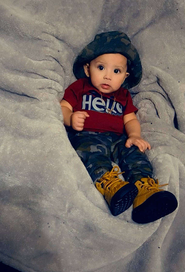 Juwan is registered to the contest to win money with this photo: baby, baby_toddler_clothing, cap, child, cool, eye, face, flash_photography, foot, freezing, fun, happy, head, headwear, human_body, people_in_nature, person, sleeve, snow, tints_and_shades