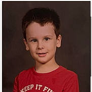 Cole is registered to the contest to win money with this photo: background, boy, casual_clothing, child, childhood, cute, expression, face, happy, indoor, kid, person, photography, portrait, posing, red_tshirt, short_hair, smiling, studio, young