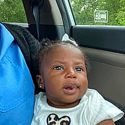 Denym joined the competition — help win amazing prizes! baby, blue_shirt, car_interior, car_seat, child, curly_hair, cute, daylight, earrings, greenery, heart, infant, leopard_print, person, portrait, seatbelt, skin, smile, white_shirt, window
