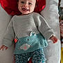 Illyana participe au concours pour gagner de l'argent avec cette photo : baby, child, clothing, cozy, cushion, cute, face, happy, head, indoor, infant, knitwear, lying_down, patterned_pants, person, red_towel, small_child, smiling, sweater, tongue_out