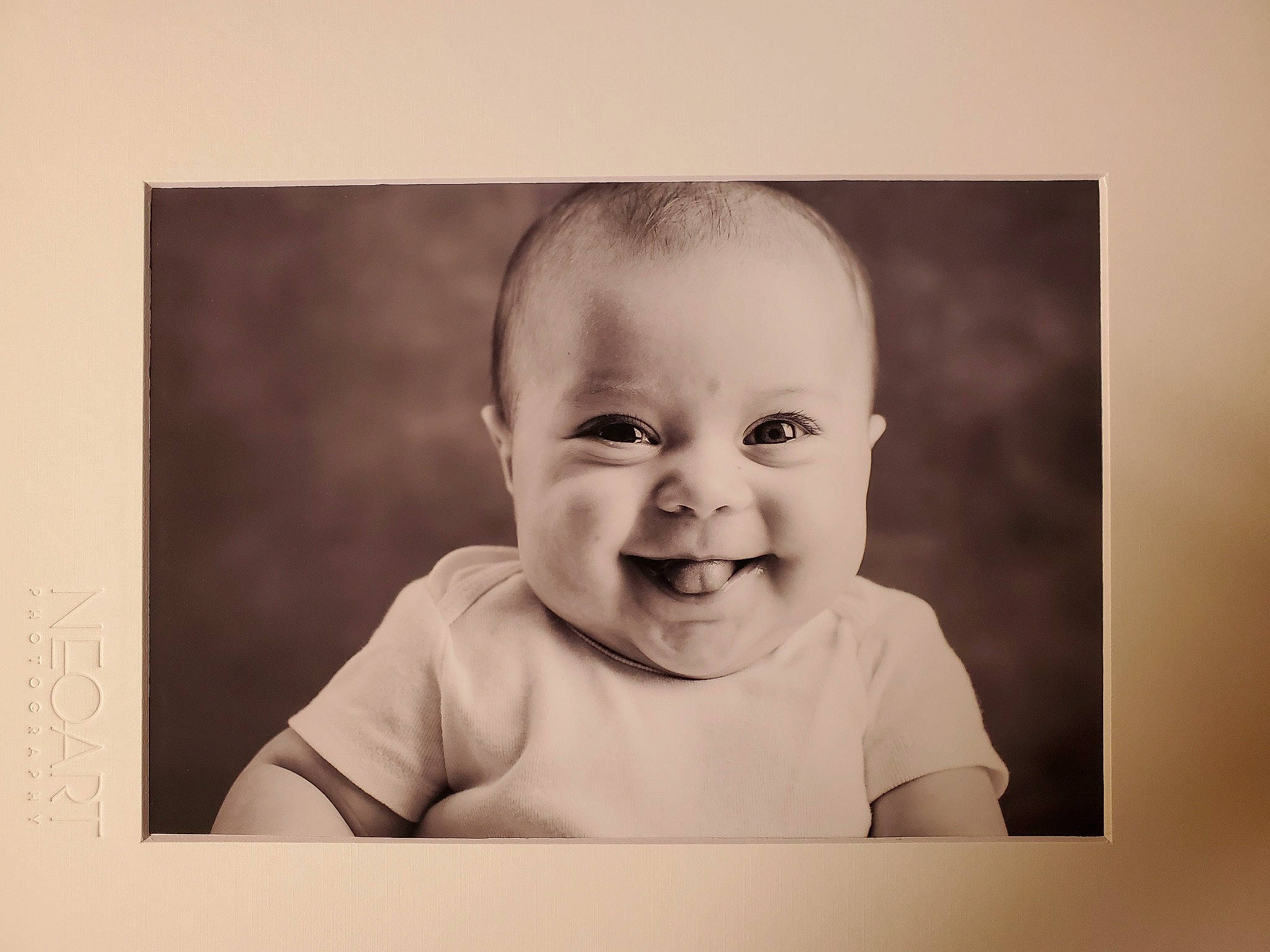 Jaida is registered to the contest to win money with this photo: baby, baby_laughing, black_and_white, cheek, child, face, facial_expression, head, joy, laugh, monochrome, person, photograph, photographic_paper, photography, picture_frame, portrait, room, smile, snapshot
