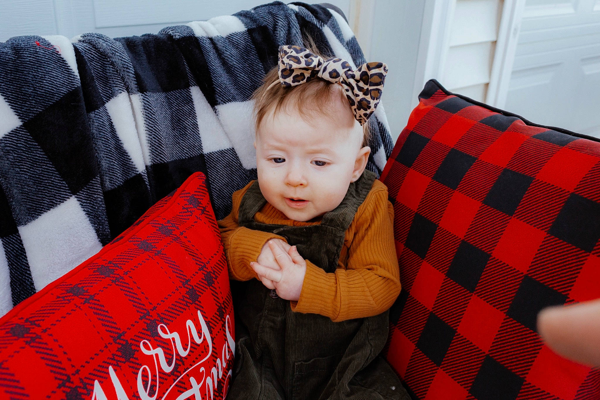 Mona joined the competition — help win amazing prizes! baby, baby_toddler_clothing, child, christmas, comfort, costume_hat, couch, event, holiday, mammal, pattern, person, plaid, product, red, sitting, sleeve, tartan, textile, toddler