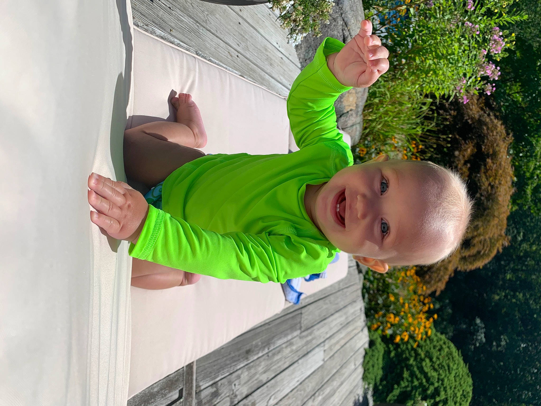 Lev is registered to the contest to win money with this photo: baby, baby_toddler_clothing, child, elbow, flower, fun, garden, gesture, grass, happy, hat, joy, leisure, people_in_nature, person, plant, play, recreation, smile, t_shirt